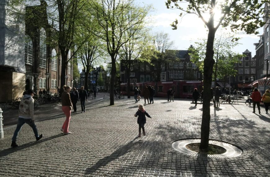 people walking on sidewalk during daytime