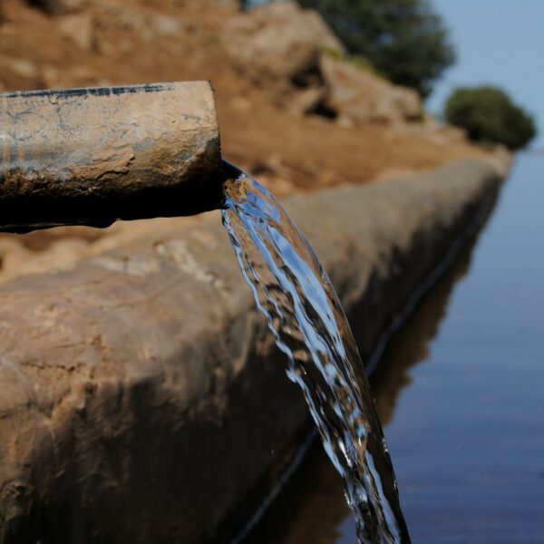a pipe that has water coming out of it