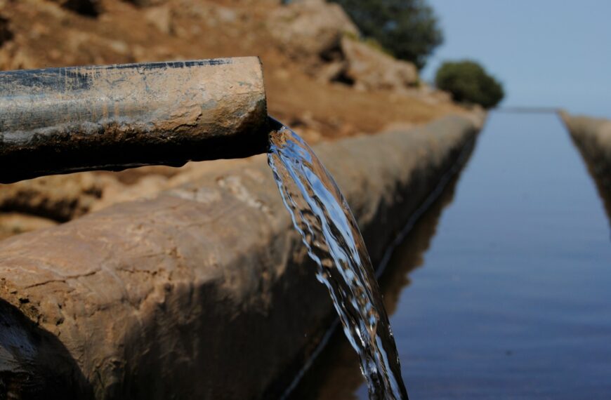 a pipe that has water coming out of it