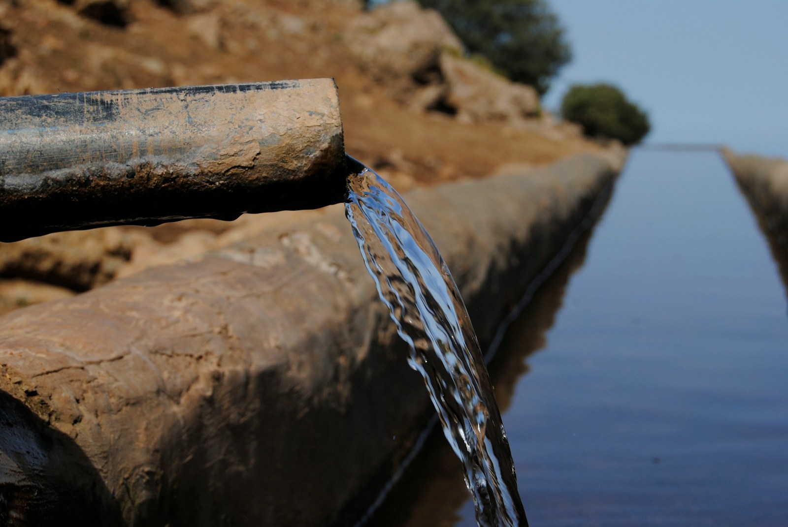 a pipe that has water coming out of it