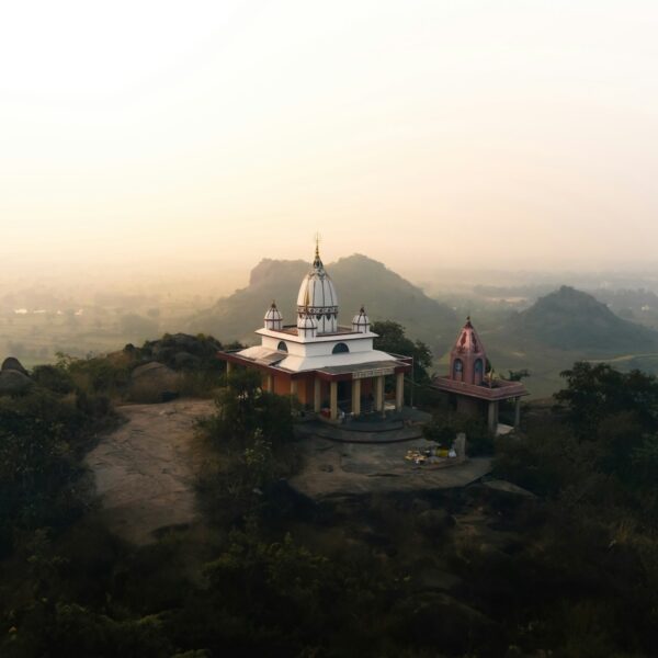 A small white building on top of a hill