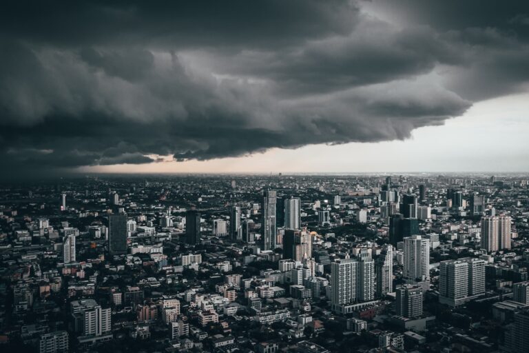 dark cloud above city buildings