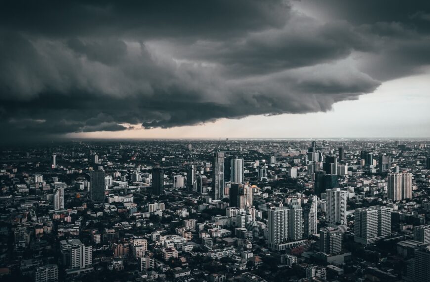 dark cloud above city buildings